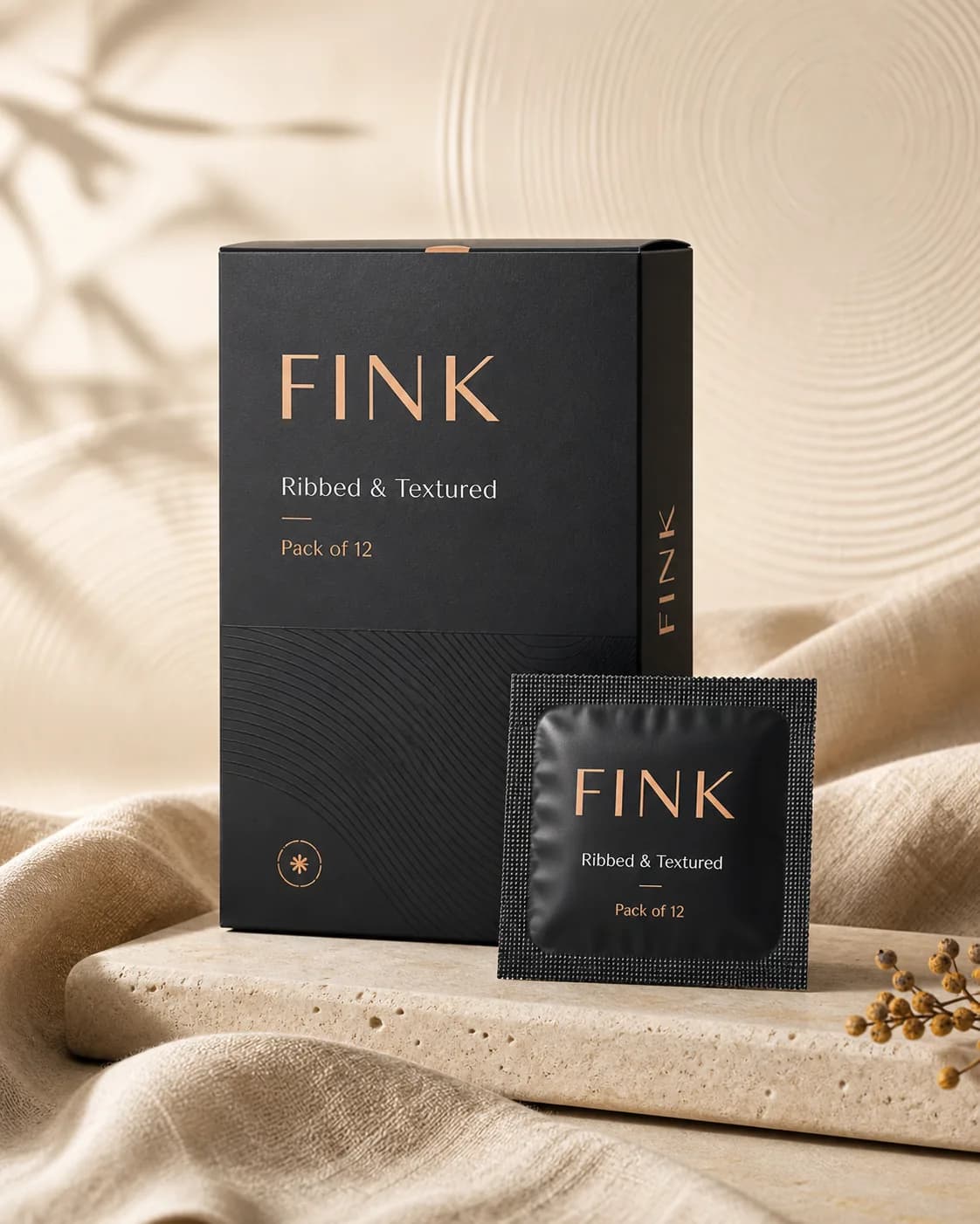 Fink Ribbed and Textured condom pack of 12 on a stone ledge