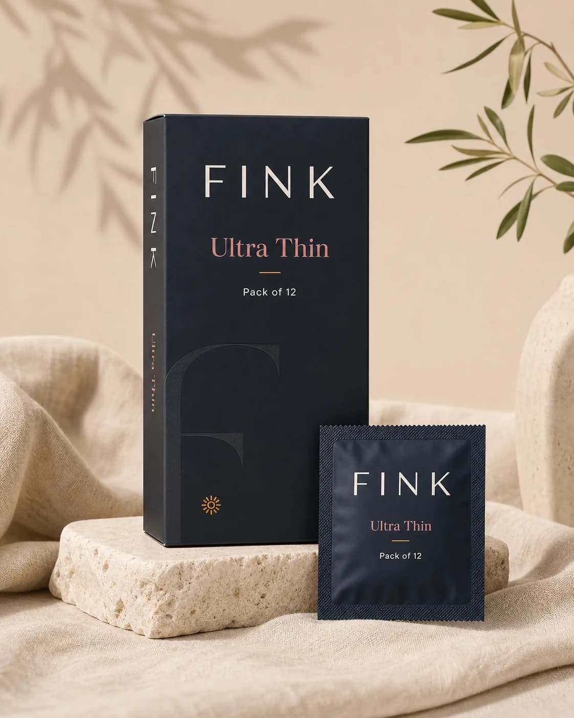 Fink Ultra Thin condom pack of 12 resting on a linen surface